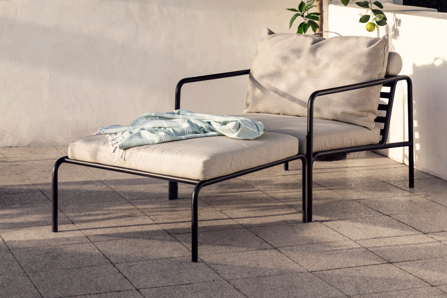Avon Outdoor Ottoman by Houe, showing avon outdoor ottoman in live shot.