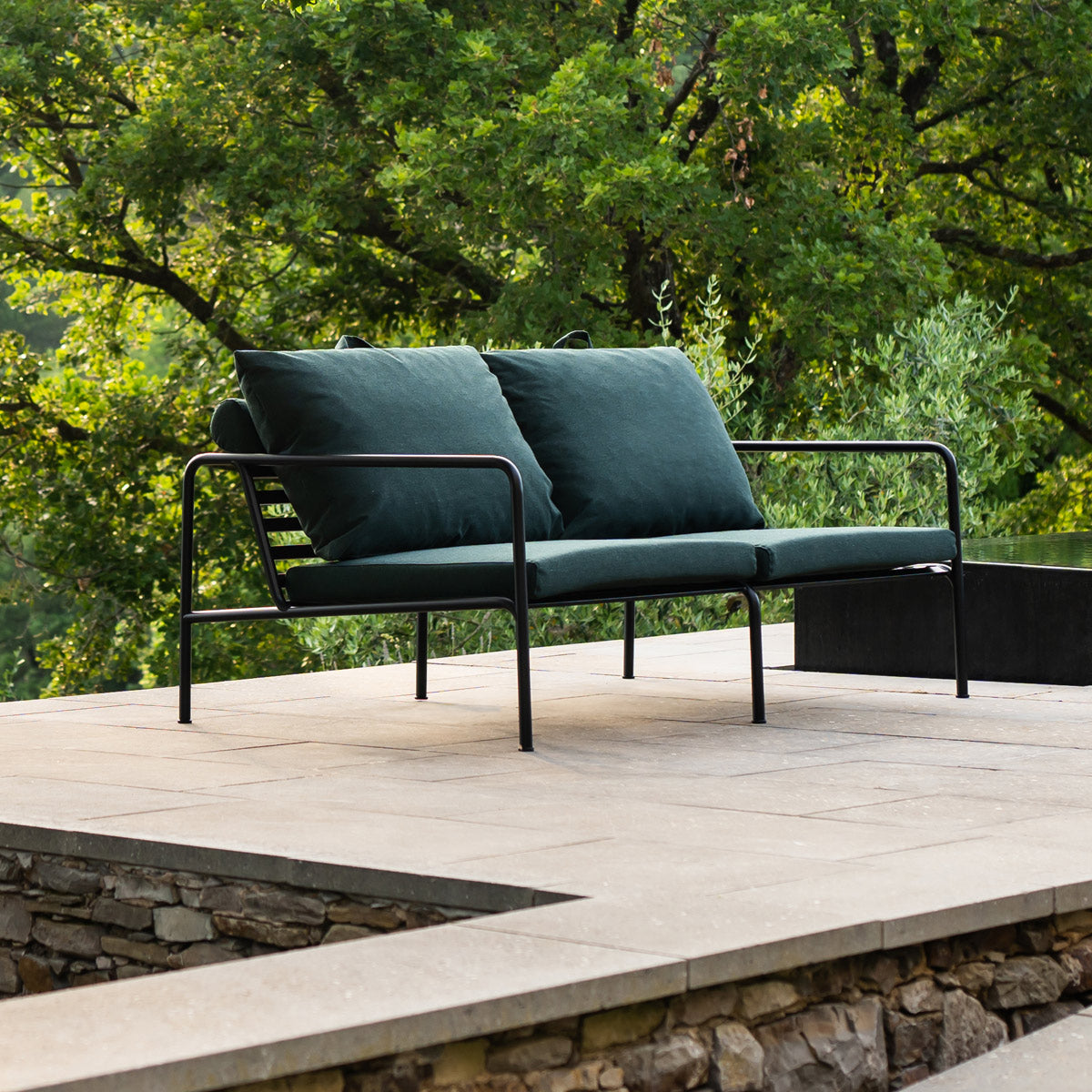 Avon Outdoor Sofa by Houe, showing avon outdoor sofa in live shot.