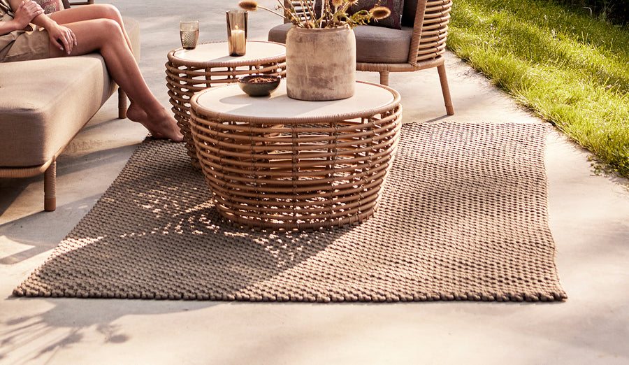 Basket Coffee Table by Cane-Line, showing basket coffee tables in live shot.