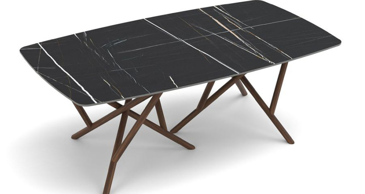 Baton Sintered Stone Top Boat Shaped Table by Copeland Furniture, showing angle view of baton sintered stone top boat shaped table.