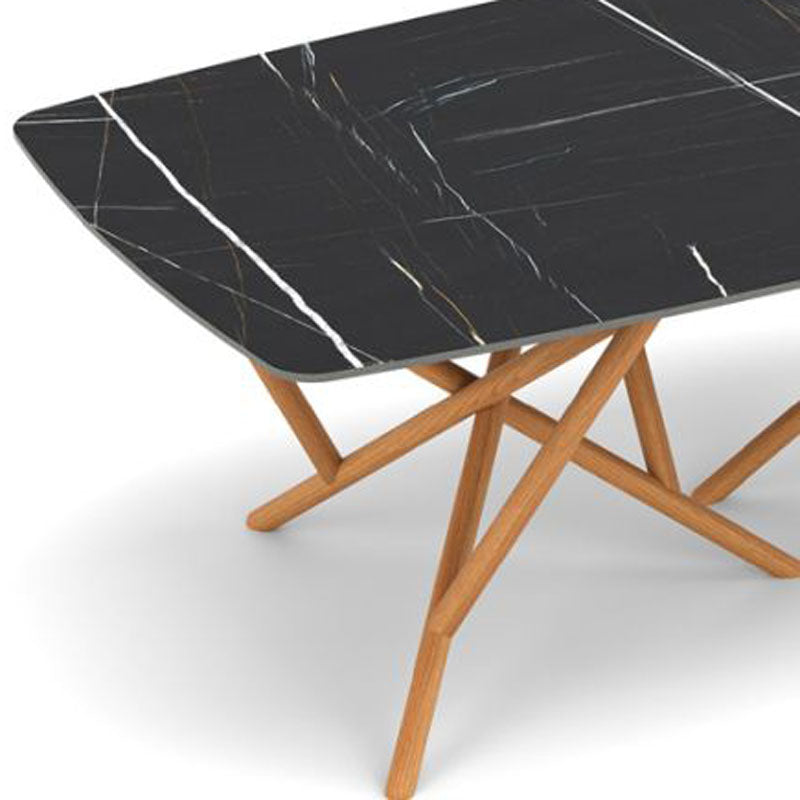Baton Sintered Stone Top Boat Shaped Table by Copeland Furniture, showing closeup view of baton sintered stone top boat shaped table.
