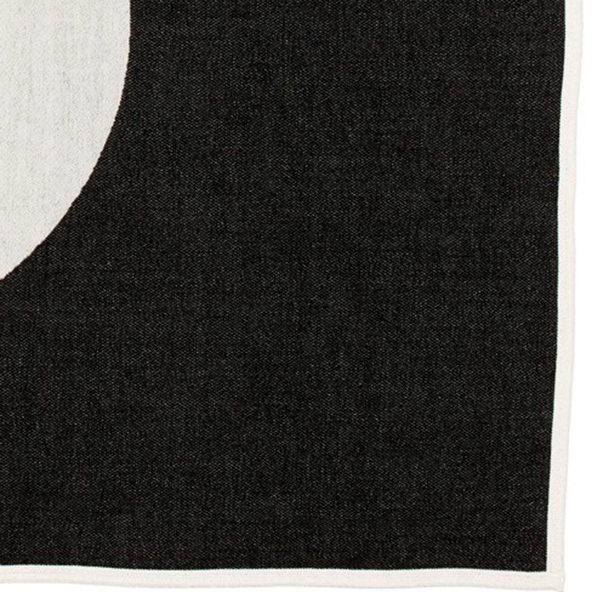 Vera Blanket by Pappelina, showing closeup view of vera black blanket.