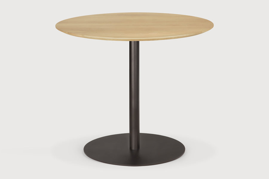 Blend Dining Table by Ethnicraft, showing blend dining table in studio shot.