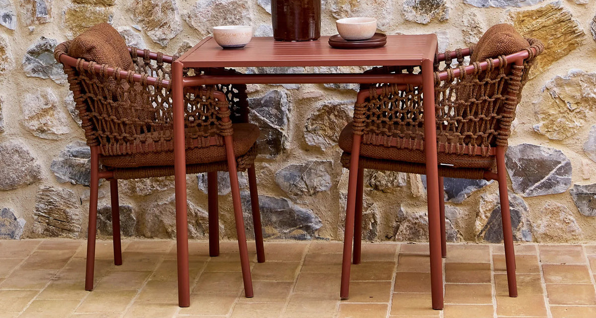 Bliss Dining Table by Cane-Line, showing bliss dining table in live shot.