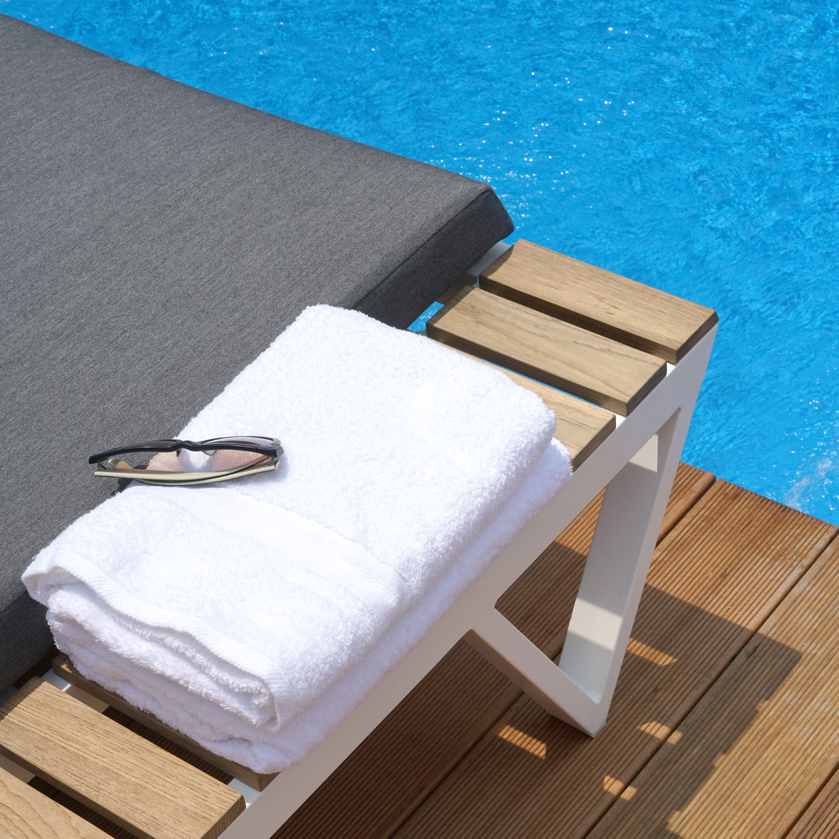 Bondi Cushion Sunbed with Teak Tray by Mamagreen, showing closeup view of bondi cushion sunbed with teak tray in live shot.