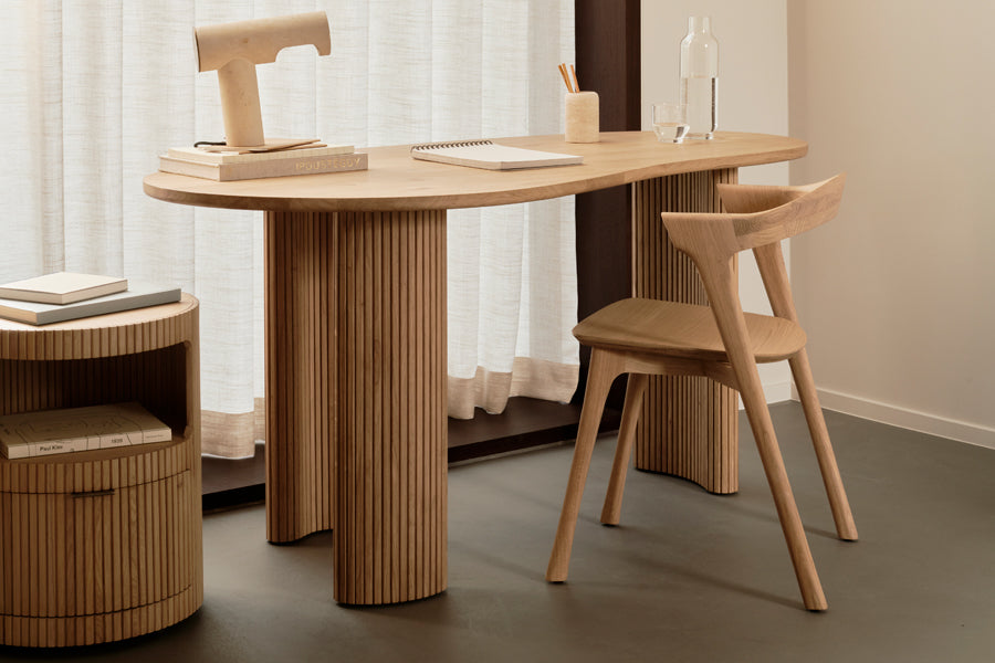 Boomerang Desk by Ethnicraft, showing boomerang desk in live shot.