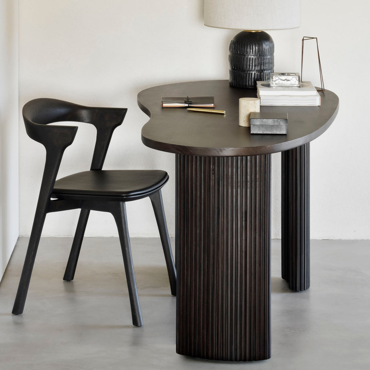 Boomerang Desk by Ethnicraft, showing boomerang desk in live shot.