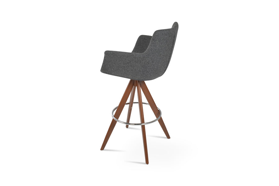 Bottega Pyramid-MW Swivel Bar Stool by SohoConcept, showing back view of bottega pyramid-mw swivel bar stool in walnut veneer steel legs & chrome footrest/camira blazer dark grey wool.