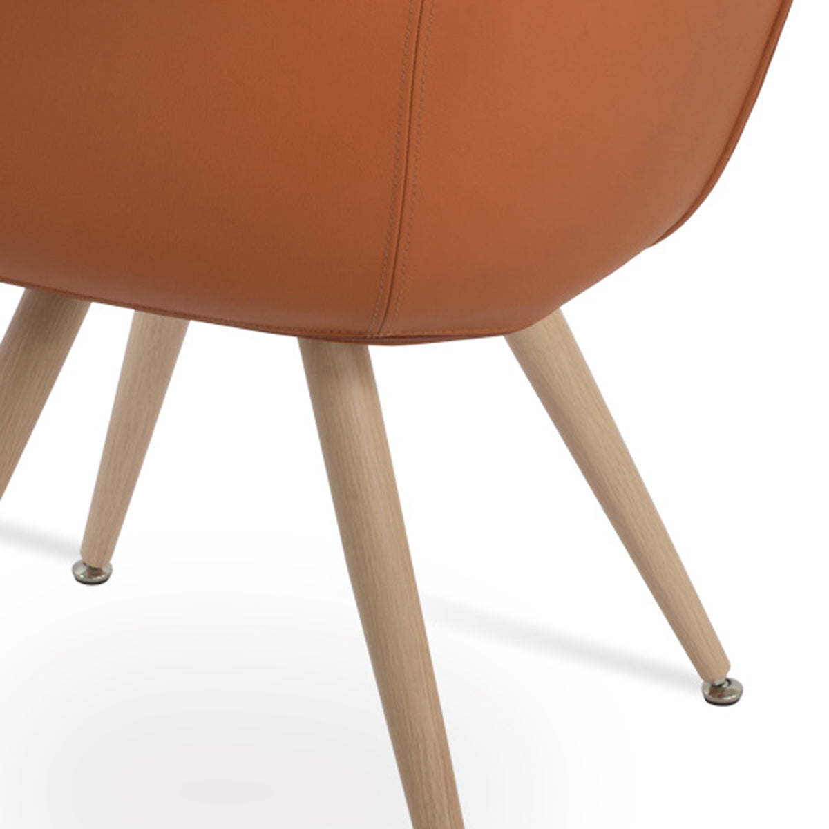 Bottega Star Armchair with Adjuster Caps by SohoConcept, showing closeup view of bottega star armchair with adjuster caps in natural veneer steel/caramel genuine leather.