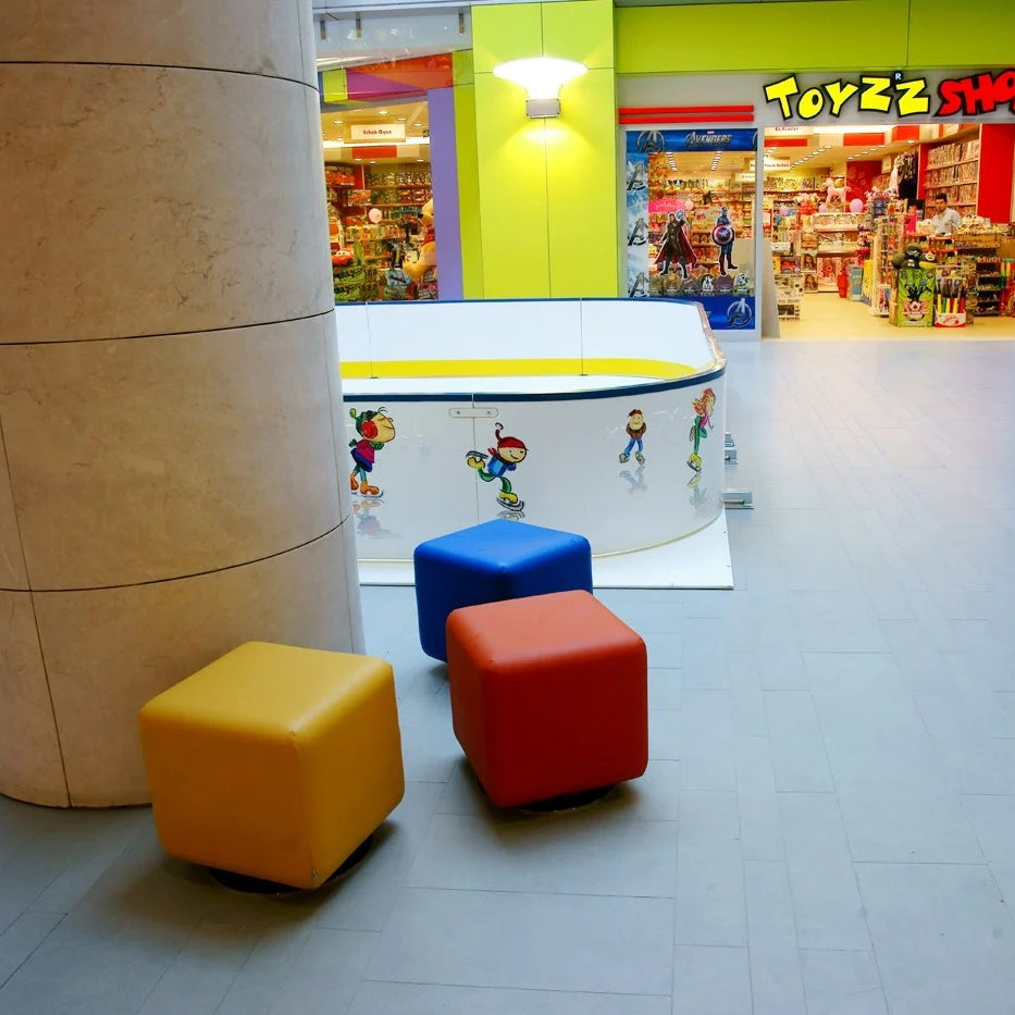 Boxer Swivel Ottoman by B&T, showing boxer swivel ottomans in live shot.