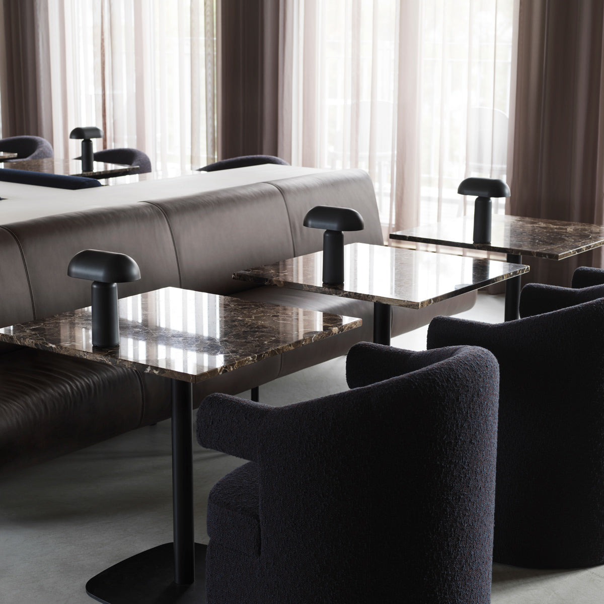 Burra Chair by Normann Copenhagen, showing closeup view of burra chairs in live shot.