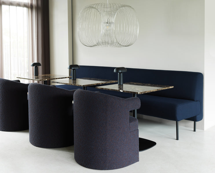 Burra Chair by Normann Copenhagen, showing burra chairs in live shot.