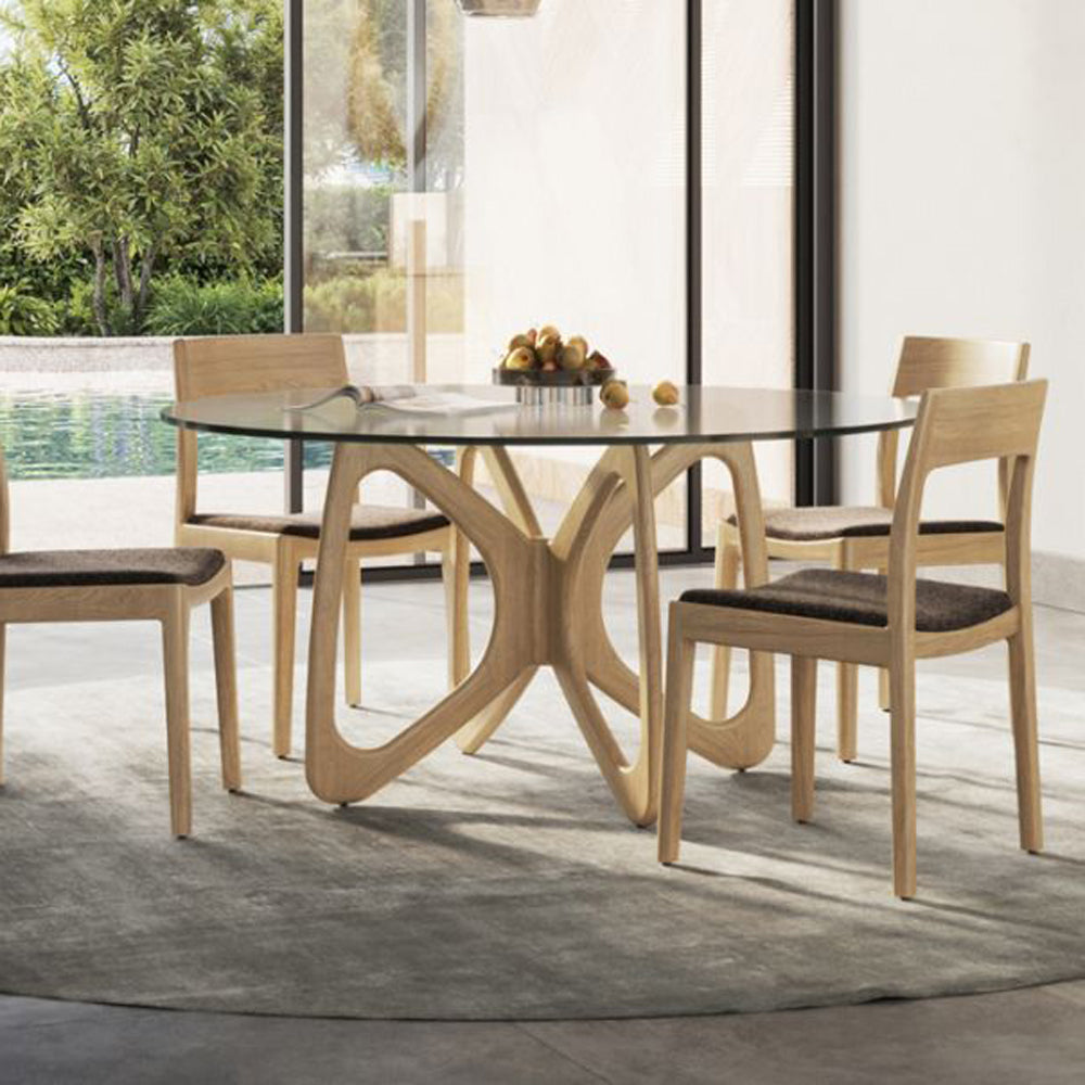 Butterfly Glass Top Round Dining Table by Copeland Furniture, showing  butterfly glass top round dining table in live shot.