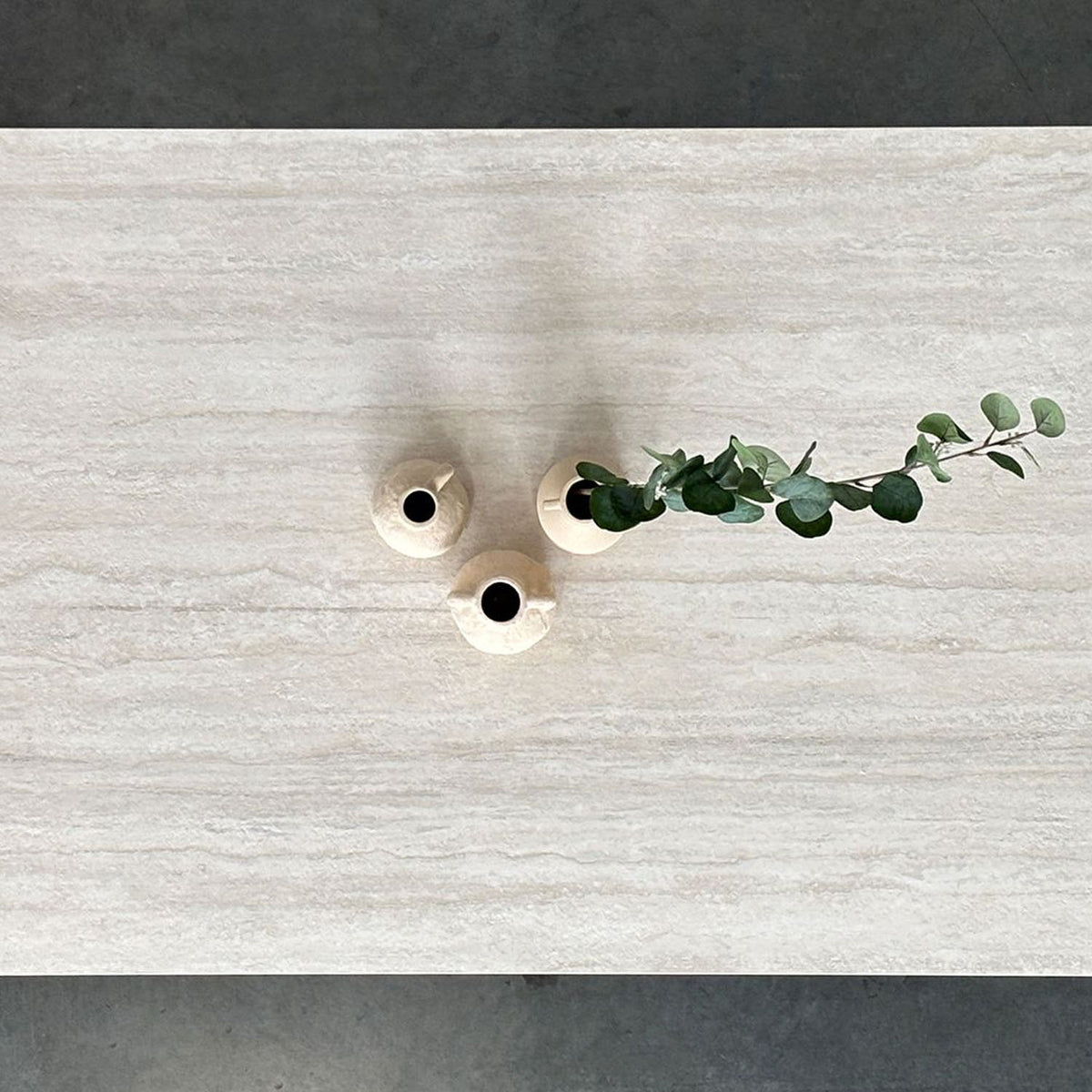 Camber Double Extension Dining Table by Mobital, showing closeup view of camber double extension dining table in live shot.