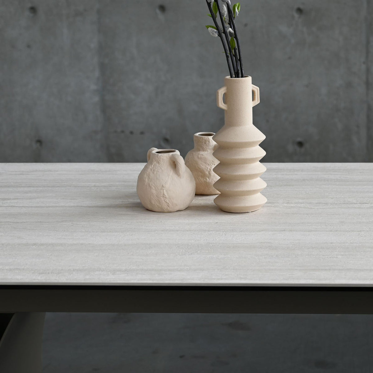 Camber Double Extension Dining Table by Mobital, showing closeup view of camber double extension dining table in live shot.