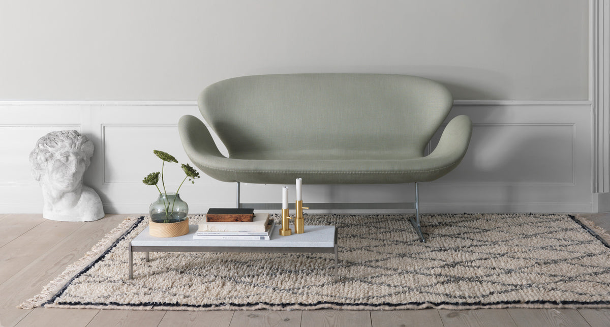 Candle Holder by Fritz Hansen, showing candle holders in live shot.