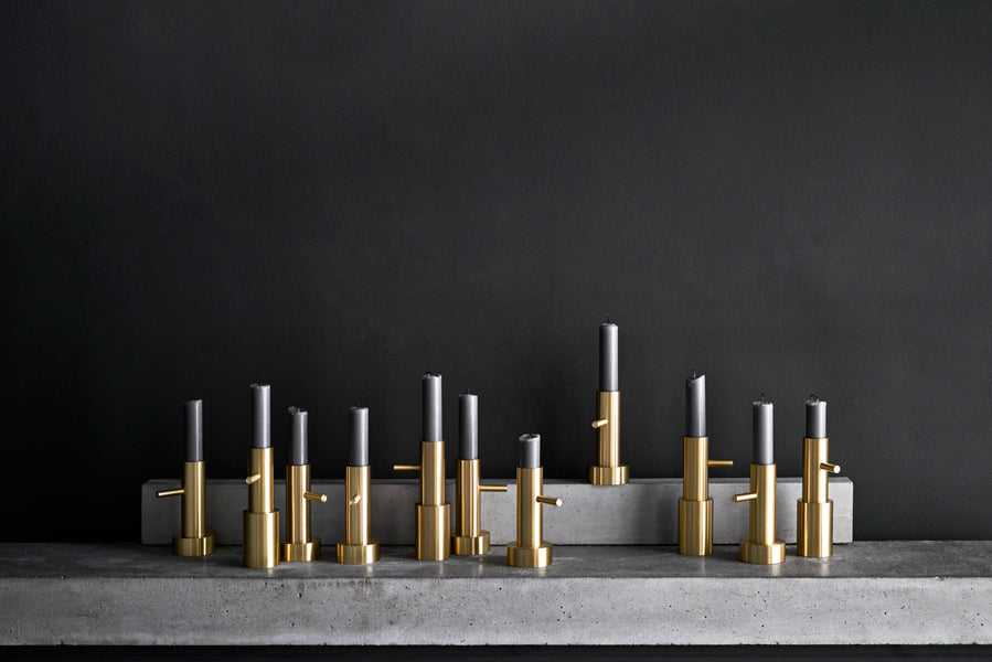 Candle Holder by Fritz Hansen, showing candle holders in live shot.