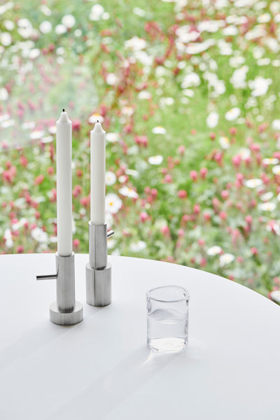 Candle Holder by Fritz Hansen, showing candle holders in live shot.
