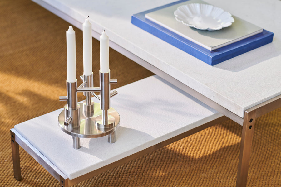 Candle Holder by Fritz Hansen, showing candle holders in live shot.