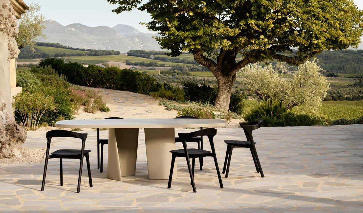 Canyon Outdoor Dining Table by Ethnicraft, showing canyon outdoor dining table in live shot.