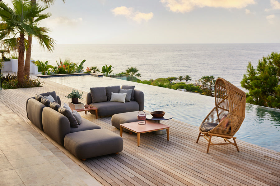 Capture Coffee Table by Cane-Line, showing capture coffee tables in live shot.