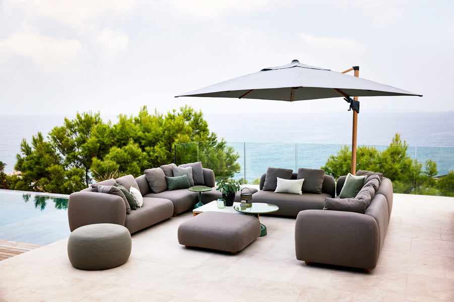Capture Coffee Table by Cane-Line, showing capture coffee table in live shot.