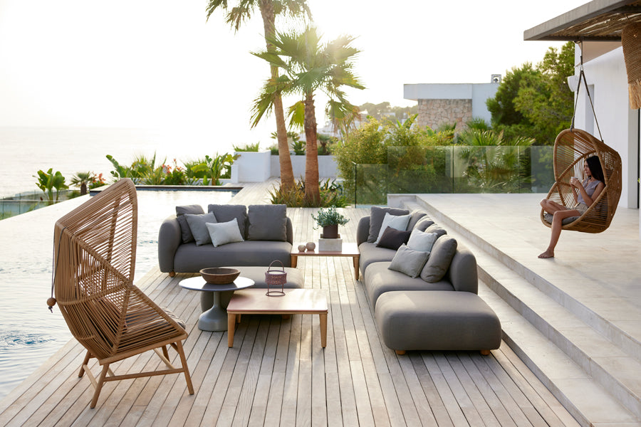 Capture Coffee Table by Cane-Line, showing capture coffee tables in live shot.