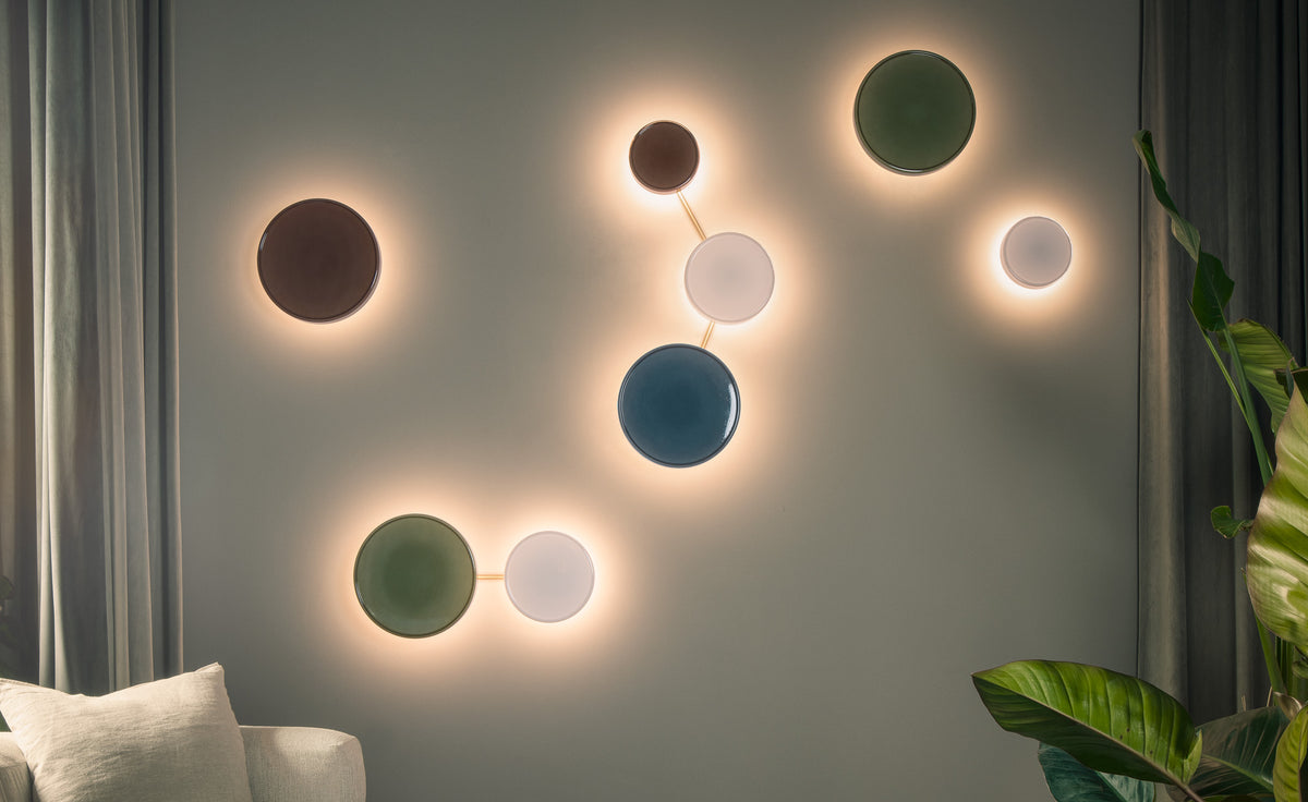 Caramel Wall Lamp by Marset, showing caramel wall lamps in live shot.