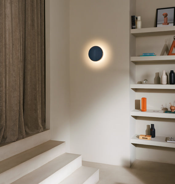 Caramel Wall Lamp by Marset, showing caramel wall lamp in live shot.