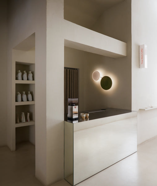 Caramel Wall Lamp by Marset, showing caramel wall lamps in live shot.