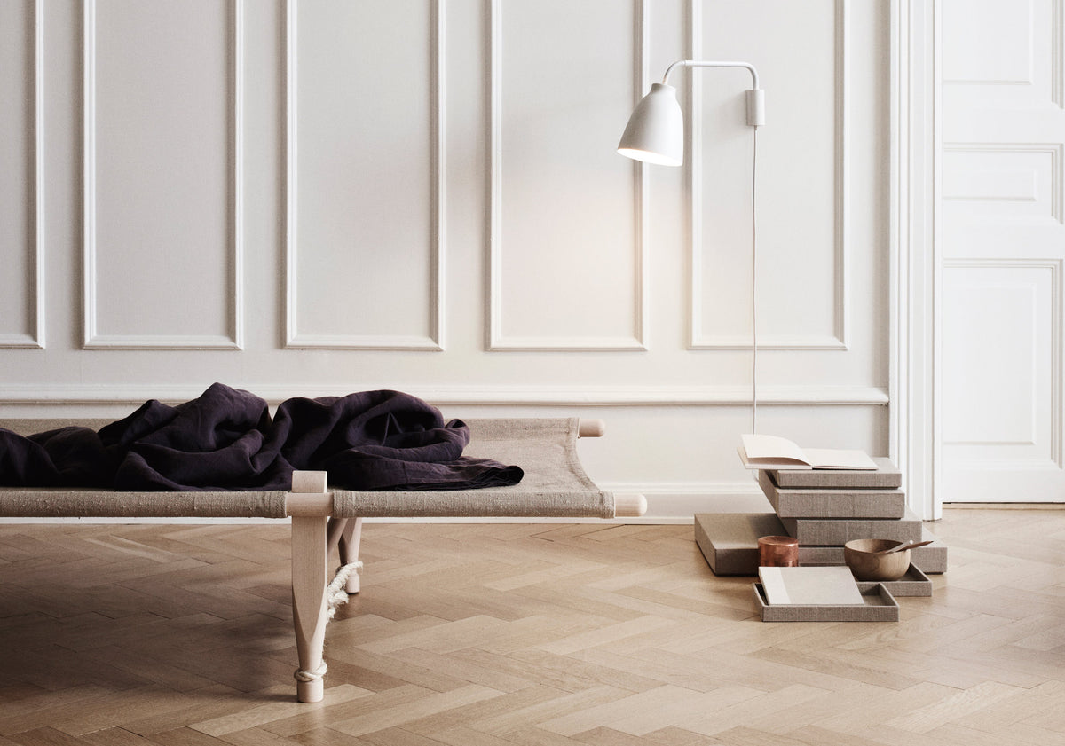Caravaggio Wall Lamp by Fritz Hansen, showing caravagio wall lamp in live shot.