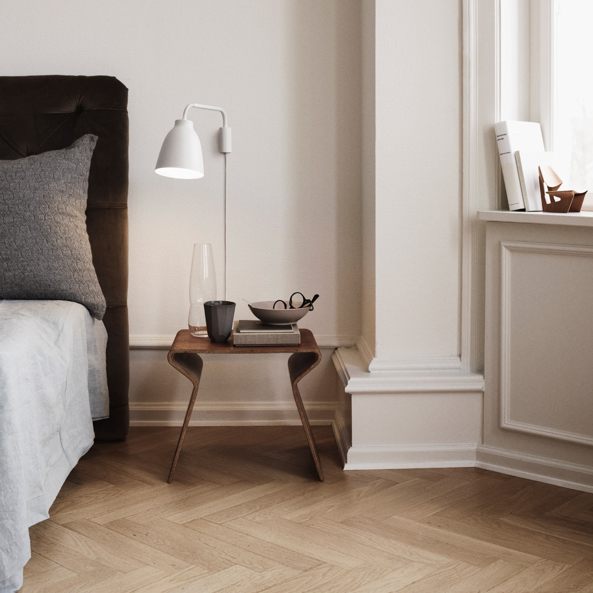 Caravaggio Wall Lamp by Fritz Hansen, showing caravagio wall lamp in live shot.