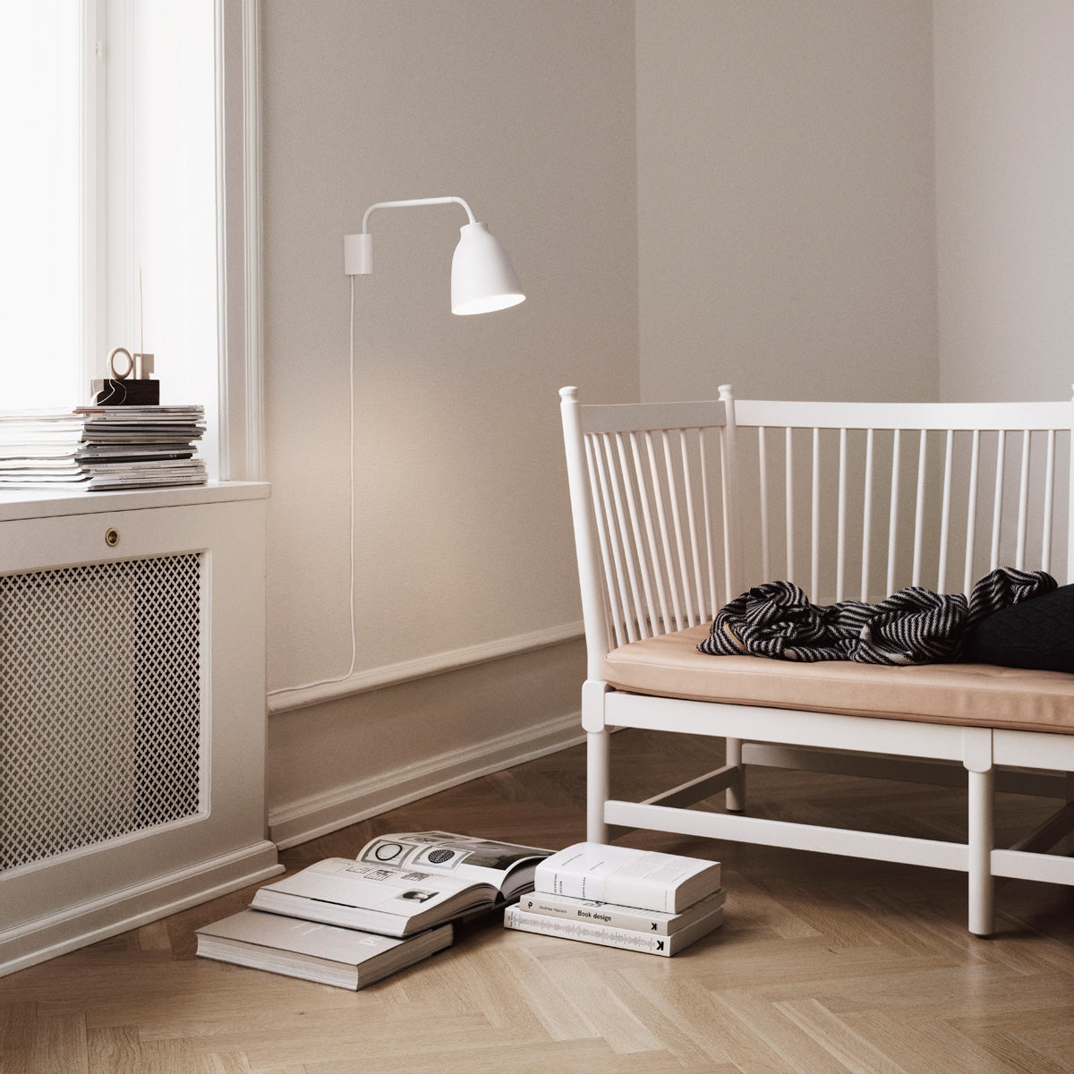 Caravaggio Wall Lamp by Fritz Hansen, showing caravagio wall lamp in live shot.
