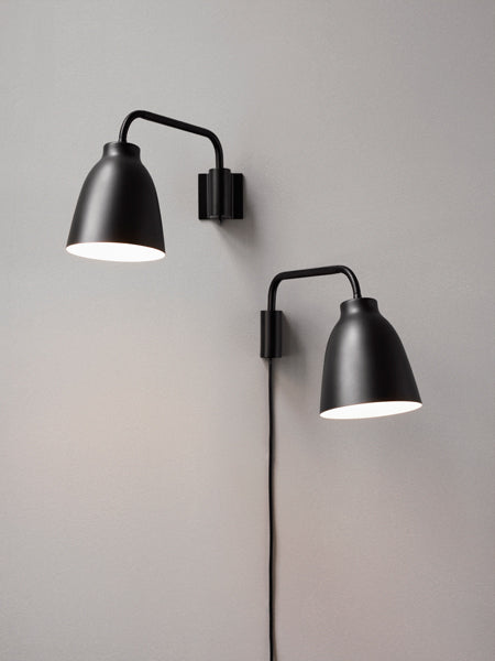 Caravaggio Wall Lamp by Fritz Hansen, showing caravagio wall lamps in live shot.