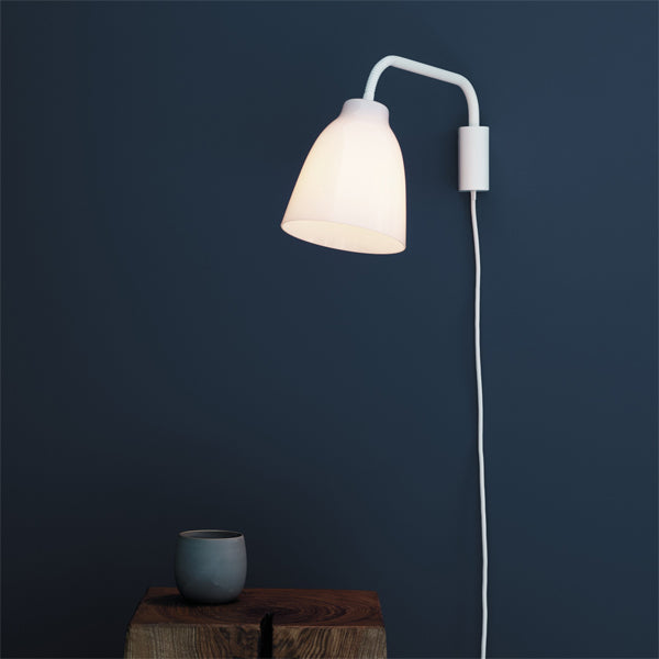 Caravaggio Wall Lamp by Fritz Hansen, showing caravagio wall lamp in live shot.