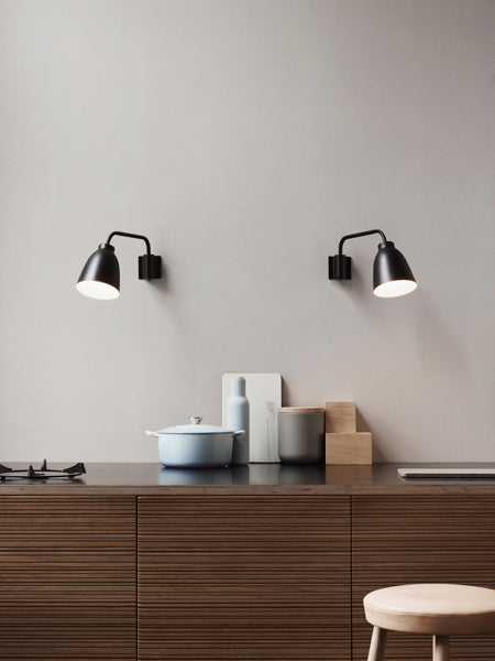 Caravaggio Wall Lamp by Fritz Hansen, showing caravagio wall lamps in live shot.