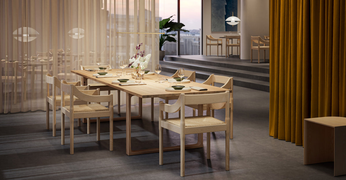Carimate Chair by Fritz Hansen, showing carimate chairs in live shot.