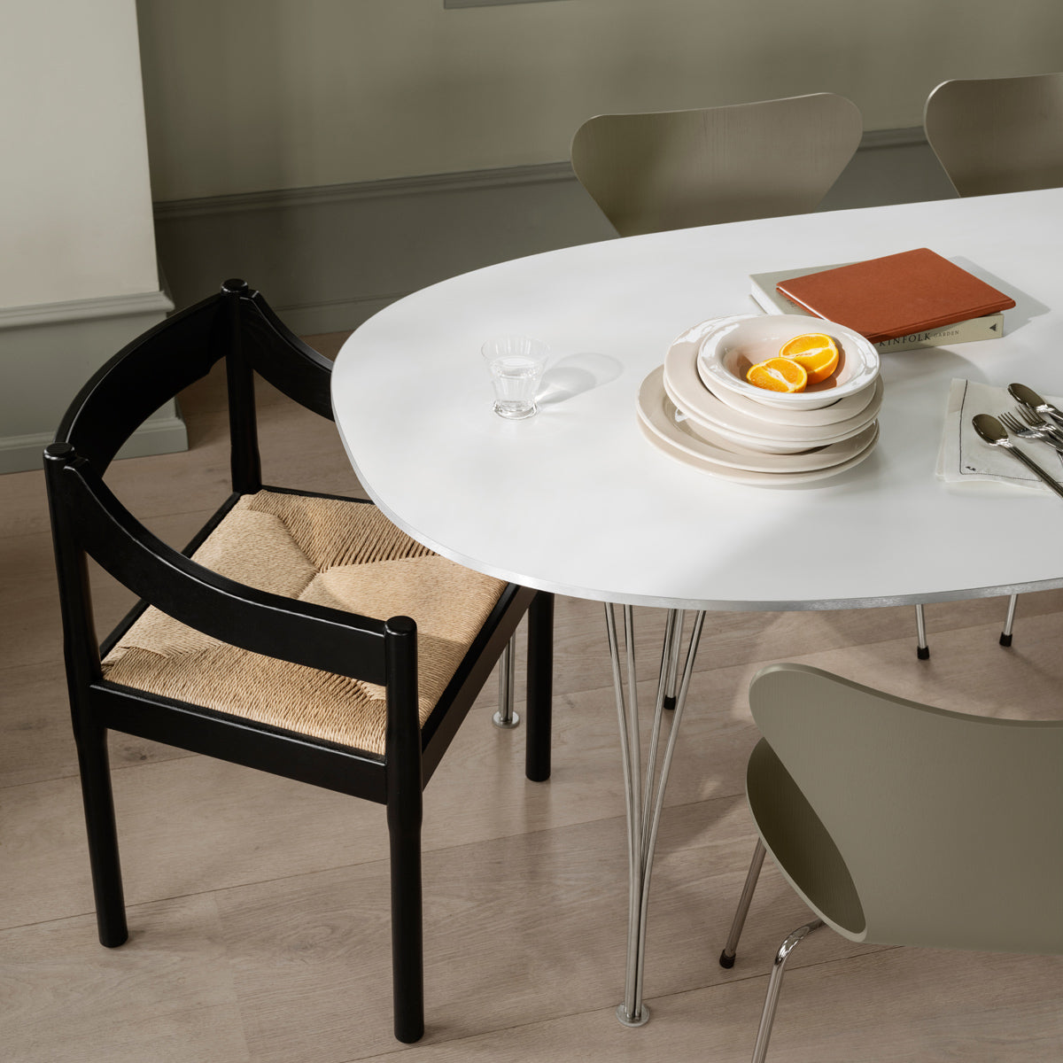 Carimate Chair by Fritz Hansen, showing carimate chair in live shot.