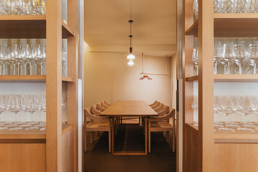 Carimate Chair by Fritz Hansen, showing carimate chairs in live shot.