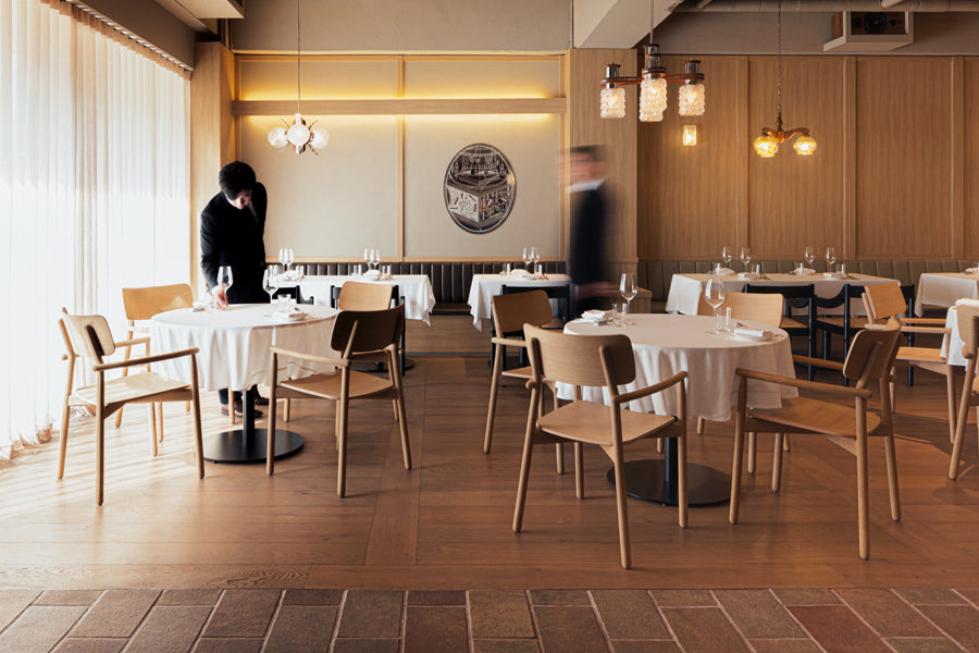 Carimate Chair by Fritz Hansen, showing carimate chairs in live shot.