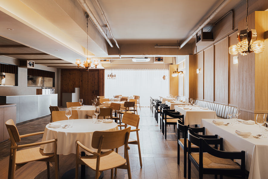 Carimate Chair by Fritz Hansen, showing carimate chairs in live shot.