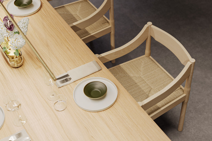 Carimate Chair by Fritz Hansen, showing closeup view of carimate chairs in live shot.