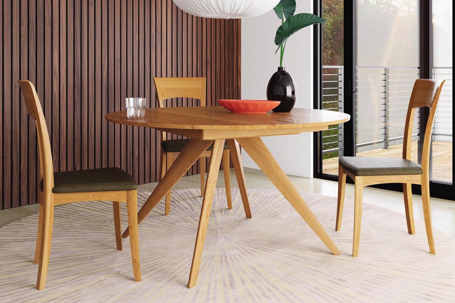 Catalina Round Extension Dining Table by Copeland Furniture, showing catalina round extension dining table with chair in live shot.