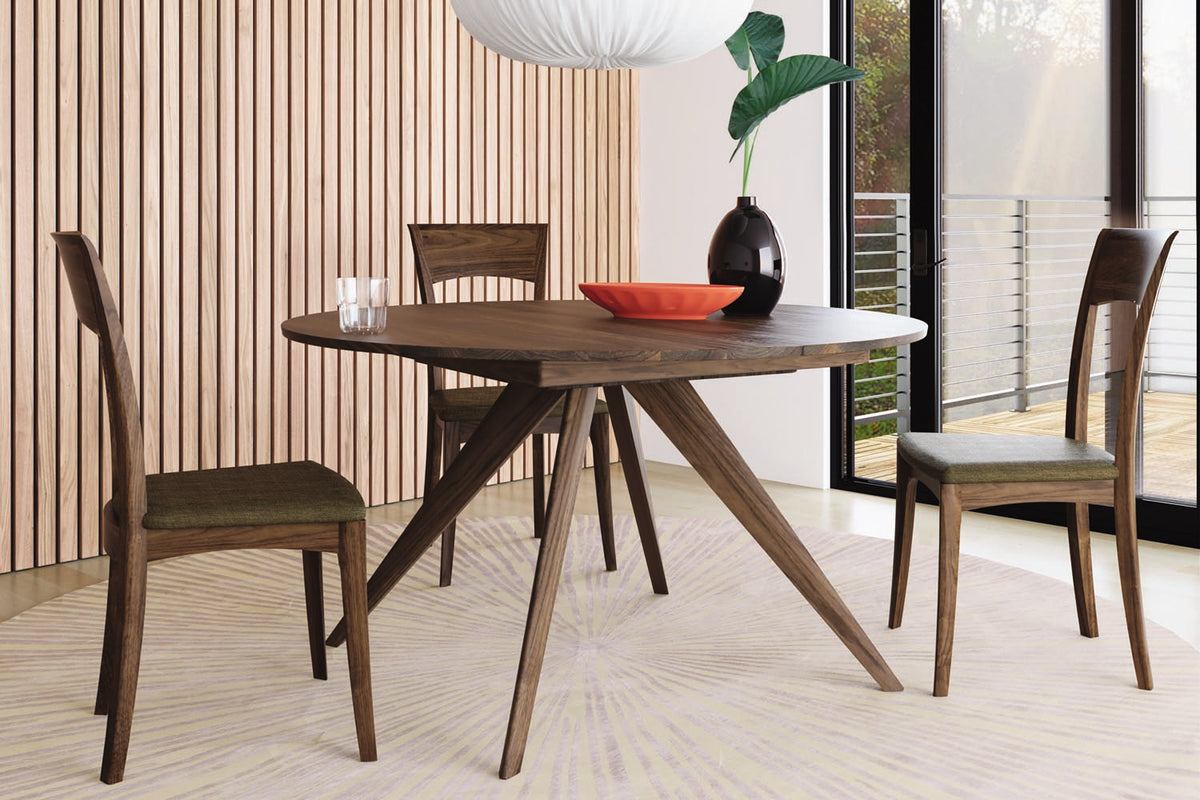 Catalina Round Extension Dining Table by Copeland Furniture, showing catalina round extension dining table with chair in live shot.