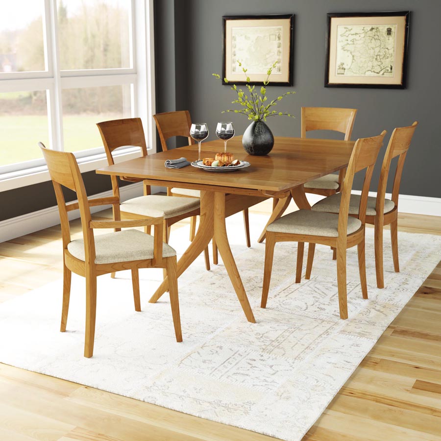 Catalina Trestle Extensions Table by Copeland Furniture, showing catalina trestle extensions table with chair in live shot.