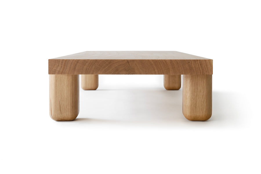 Centenniale Coffee Table by Nikari, showing side view of contenniale coffee table in oak wood.