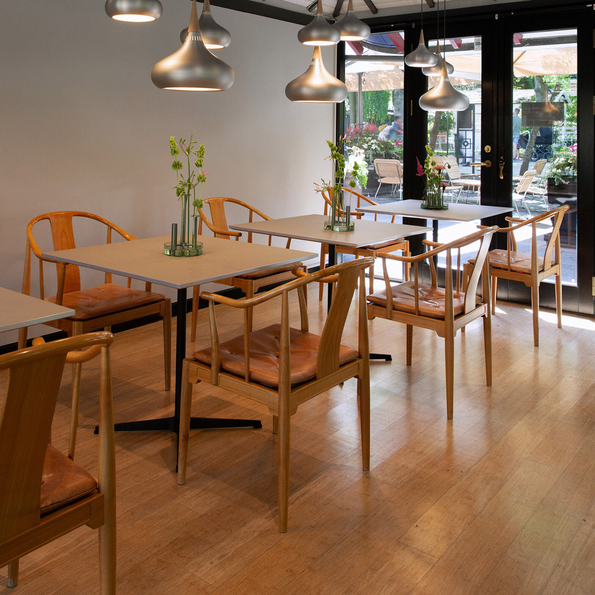 China Chair by Fritz Hansen, showing china chairs in live shot.