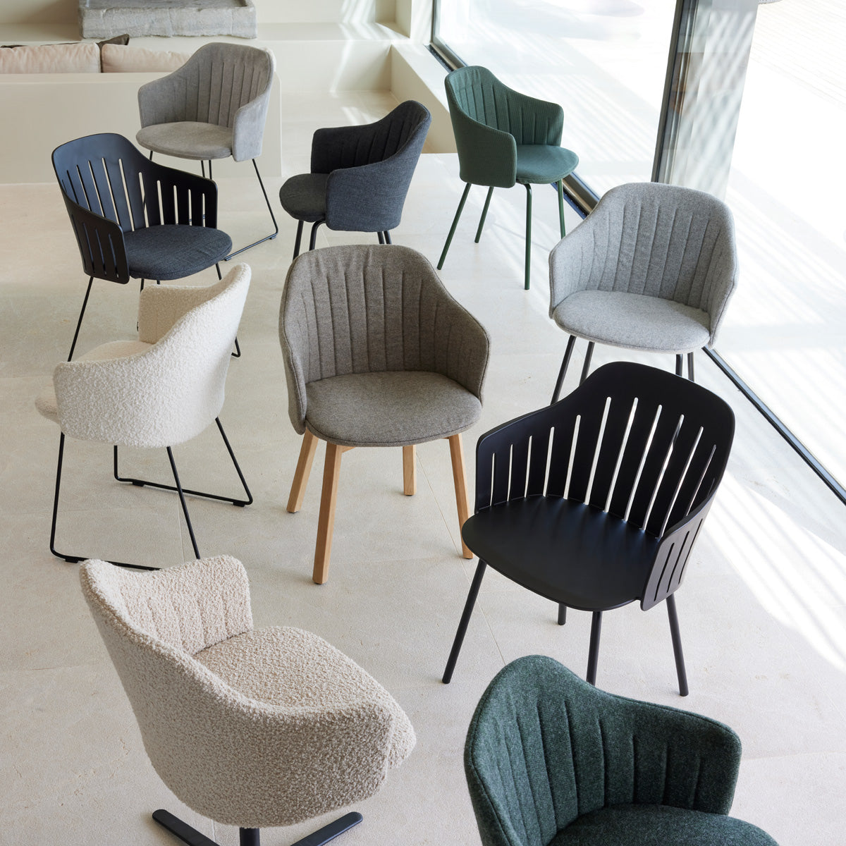 Choice 4 Legs Dark Green Steel Chair by Cane-Line, showing choice 4 legs dark green steel chairs in live shot.