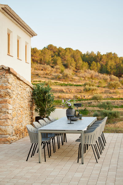 Choice 4 Legs Outdoor Chair by Cane-Line, showing choice 4 legs outdoor chairs in live shot.