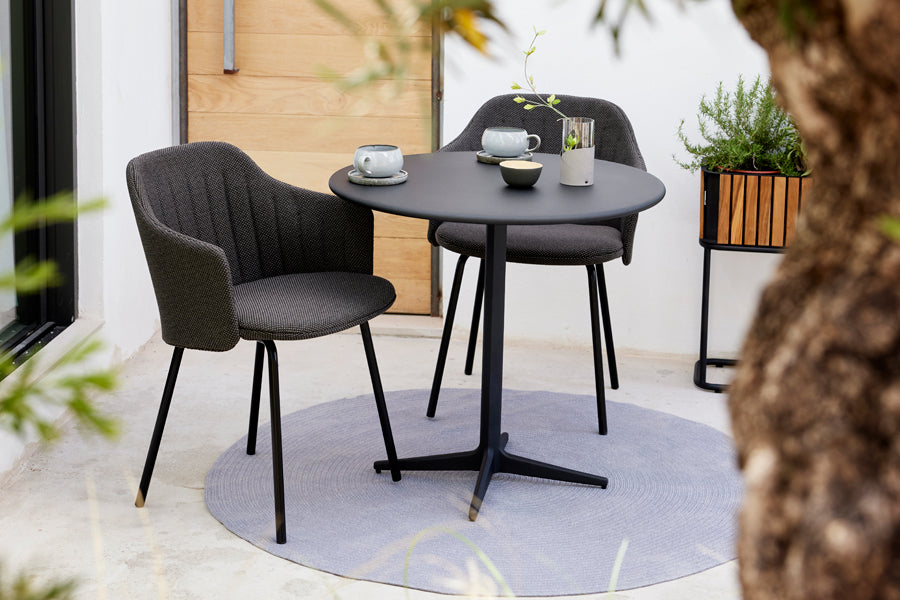 Choice 4 Legs Outdoor Chair by Cane-Line, showing choice 4 legs outdoor chairs in live shot.